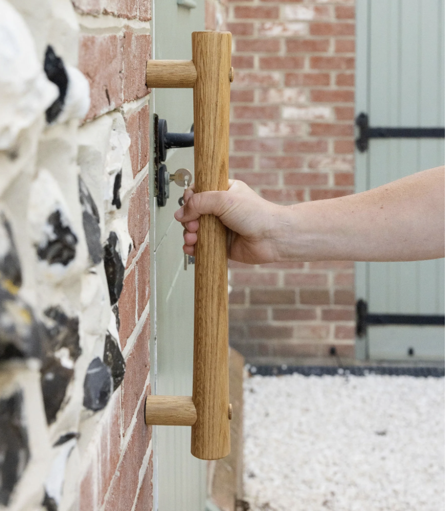 Hand grabs outdoor handrail for support